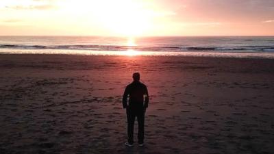 Migrant on beach