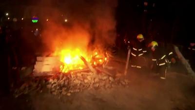 A burning barricade erected by protesters in Ukraine