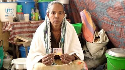 Mulu Taddesse with a picture of her dead son