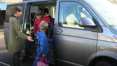 Children getting out of car