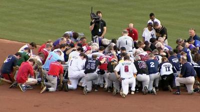 Republicans and Democrats pray together before baseball game