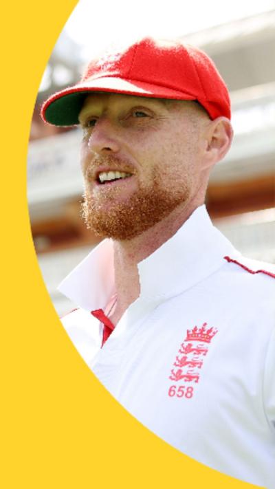 Ben Stokes is wearing a red cap and a white England kit