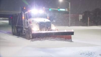 Snow plow on road