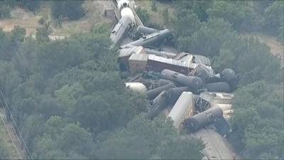 Train derailment seen between trees