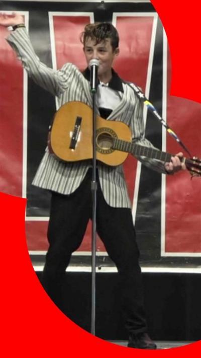 Cooper performing as Elvis