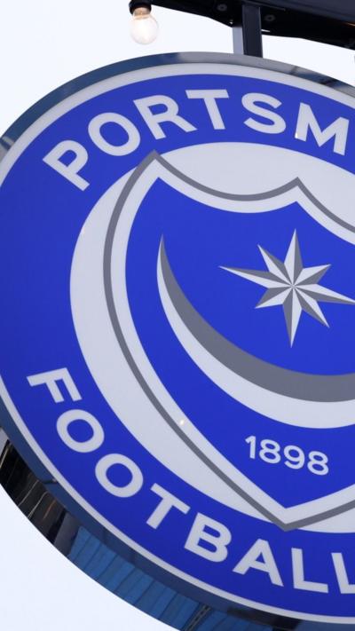 A close up of the blue Portsmouth FC sign at Fratton Park.