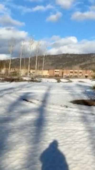 Screengrab of video where the school is visible in the distance