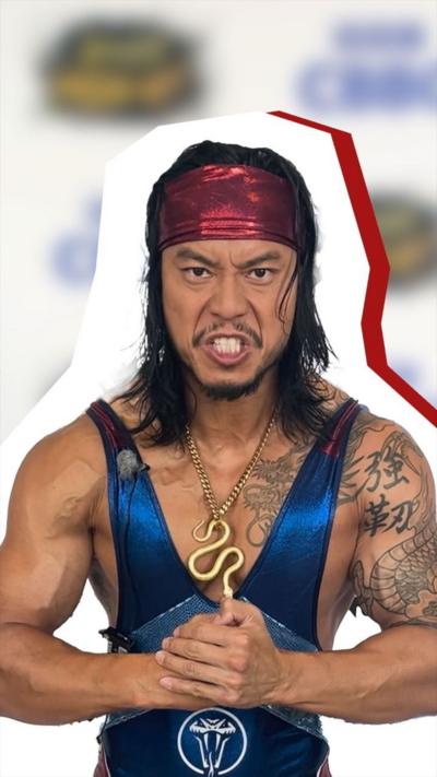 A man in a blue unitard and red bandana clenches his fists.