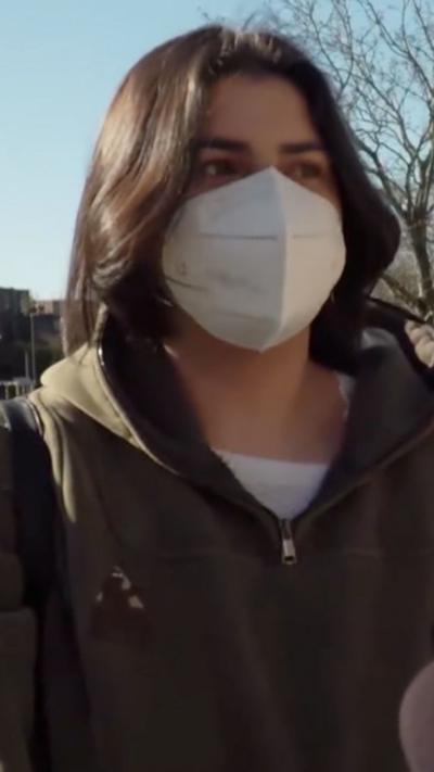 A woman wearing a surgical mask