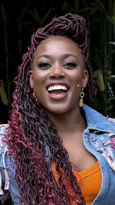 Georgina Onuorah singing on open-air stage