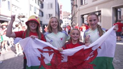 Children holding the Welsh flag