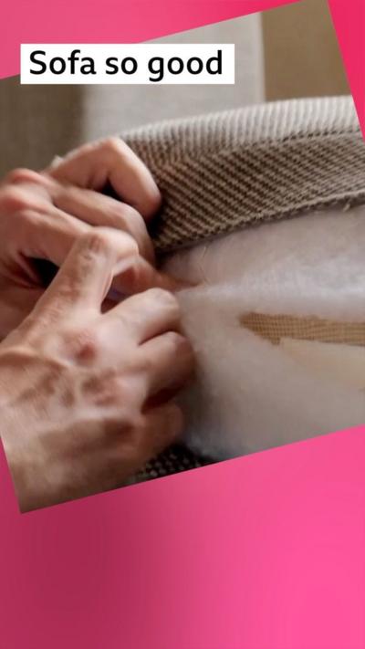 Hands zipping a cushion