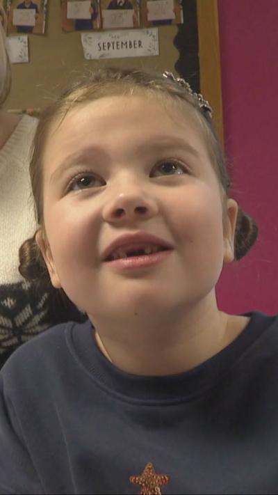 Child smiles at camera