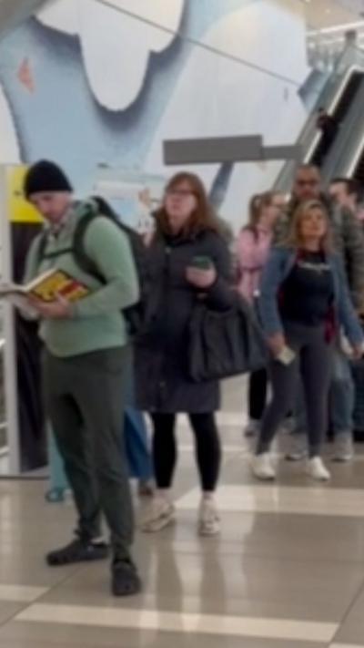 People wait in line. 