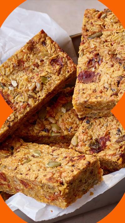 SAVOURY FLAPJACKS CUT INTO RECTANGLES IN A LINED CONTAINER