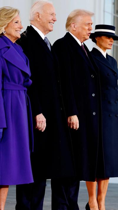 Joe Biden, Donald Trump and their wives, stand on the steps of the White House