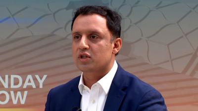 Scottish Labour leader, Anas Sarwar, wears a white shirt and dark blue blazer