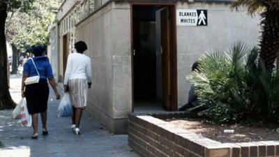 Building with white-segregation sign