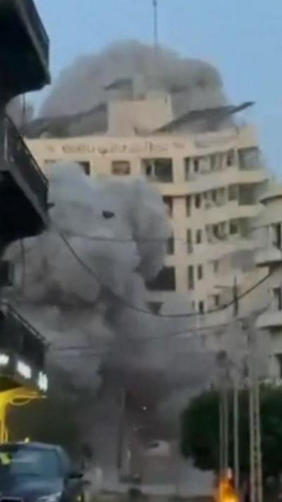 A building collapsing in Beirut