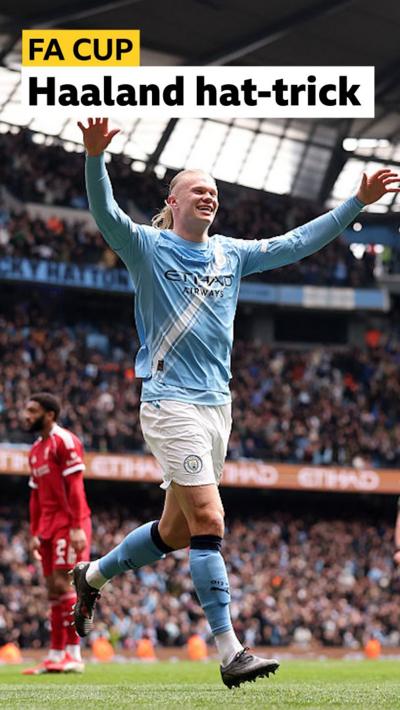 Erling Haaland of Manchester City celebrates his goal with both hands aloft 