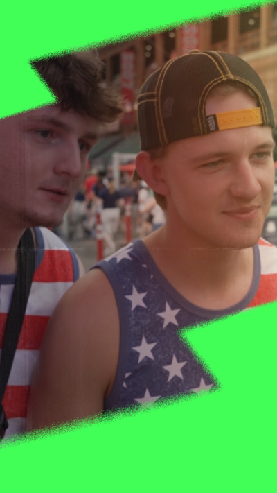 Two young men attend a Boston Red Sox game