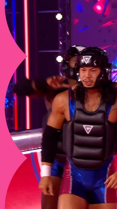 Gladiator Viper wearing a red and blue lycra suit with a black helmet and black body armour.