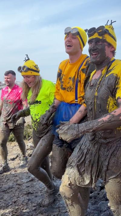 People dressed as Minions are covered in mud as the compete in the Maldon Mud Race 2026