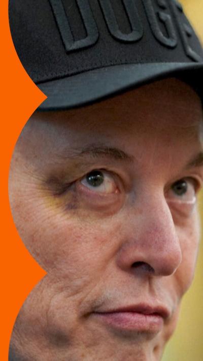 Close up of Elon Musk, wearing a DOGE cap and with bruising around his eye.
