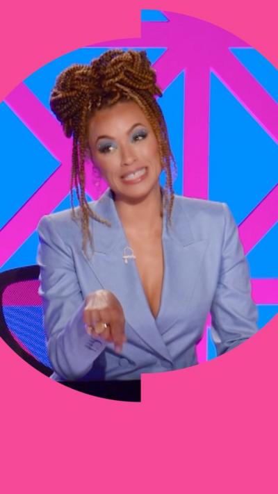 Michelle de Swarte makes a funny face. She has braids and wears a blue blazer.