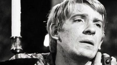 Actor David Warner on stage in Hamlet.