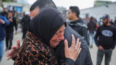 A woman cries as Palestinian prisoners are greeted after being released from an Israeli jail, as part of a hostages-prisoners swap and a ceasefire deal in Gaza between Hamas and Israel, in Khan Younis in the southern Gaza Strip, February 8, 2025