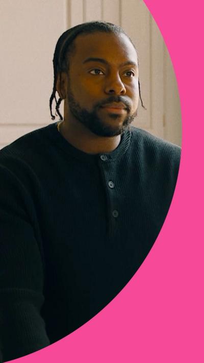 Tevin has braids and wears a black top 