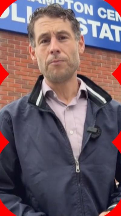 Nick Johnson stands outside a Southampton Central Police Station sign. He is wearing a navy jacket and looks at the camera.