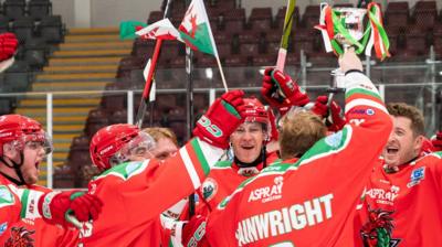 Deeside Dragons players celebrate with Welsh Cup trophy