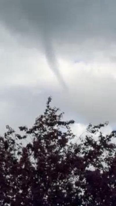 A tornado-type cloud in grey skies 