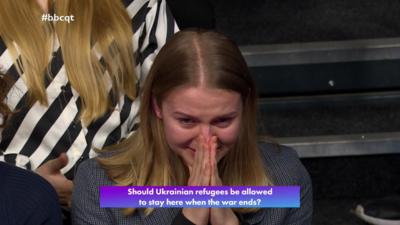 Woman with blonde hair crying in the BBC Question Time audience.