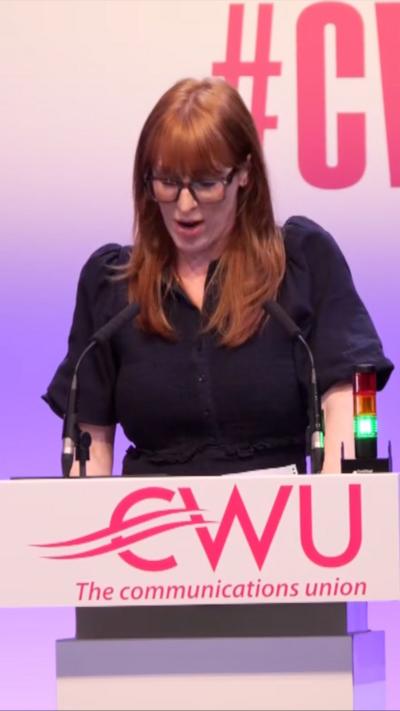 Angela Rayner speaks at a lectern wearing a black dress