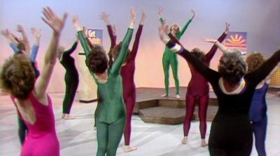 Diana Moran and a group of women stretch their arms