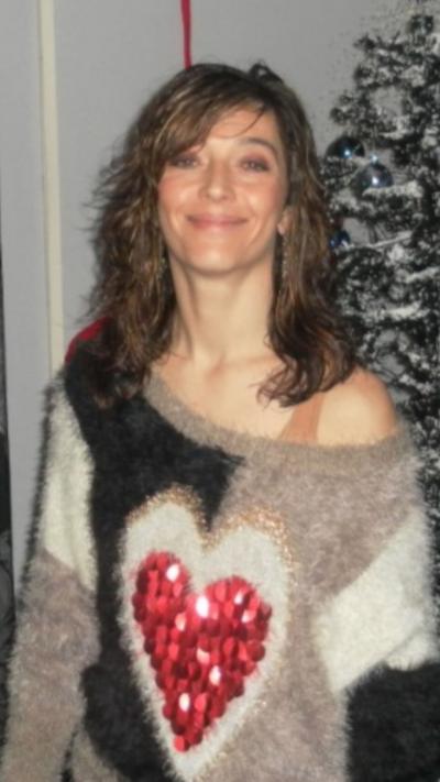 Woman wearing jumper with heart.