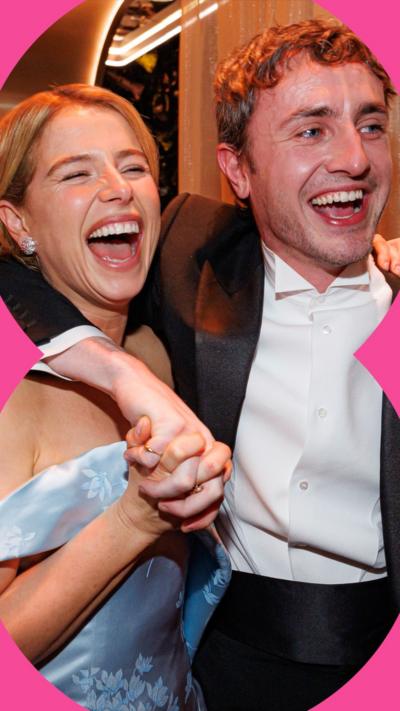 Jessie Buckley, in a blue strapless dress, and Paul Mescal, in a tuxedo, laugh with their arms around each other