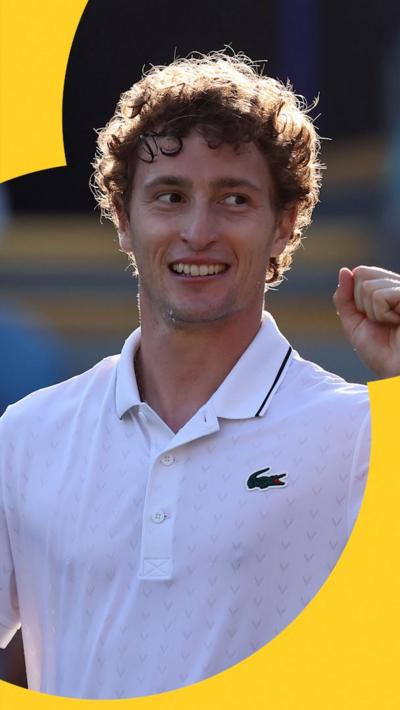 Ugo Humbert pumps his fist and smiles 