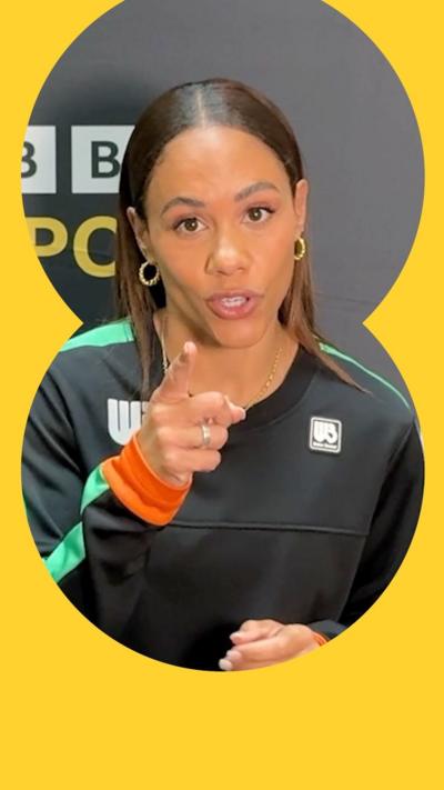 Woman ins sport kit pointing at the camera