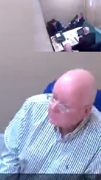 Bald man with glasses