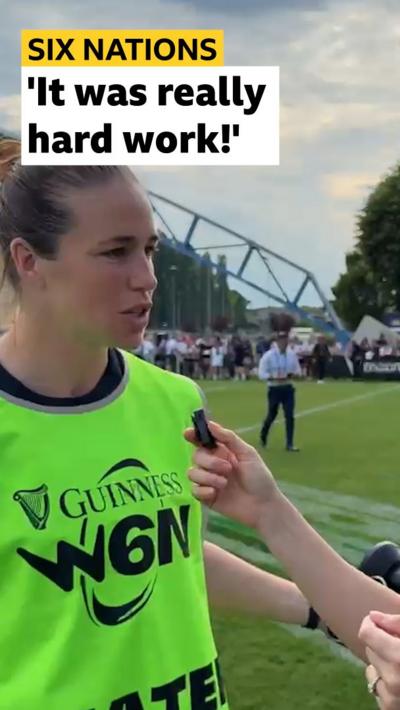 Emily Scarratt being interviewed and wearing green Women's Six Nations bib
