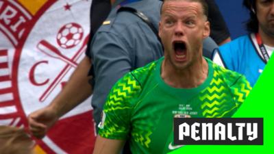 Norway goalkeeper Orjan Nyland reacts after saving Bruno Guimaraes' penalty