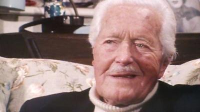 A close up of Frank Prentice, an old man with white hair and a moustache.