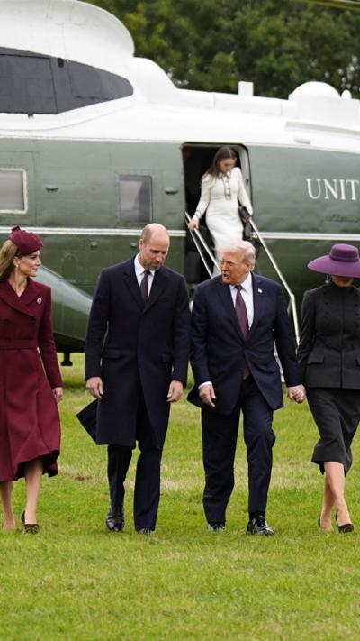 Kate, William, Trump and Melania walking, with helicopter behind them