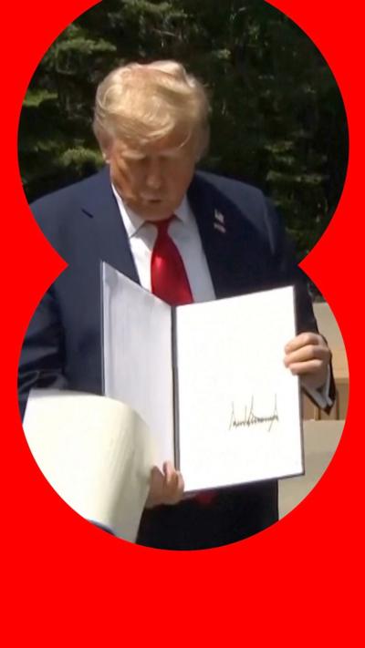 Screengrab of video showing moment Trump drops papers