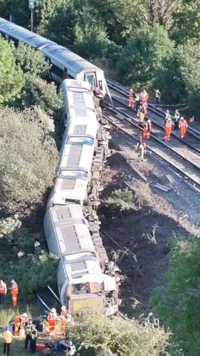 Derailed train seen on tracks from aerial view
