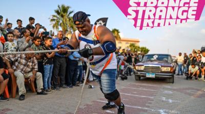 man pulling car
